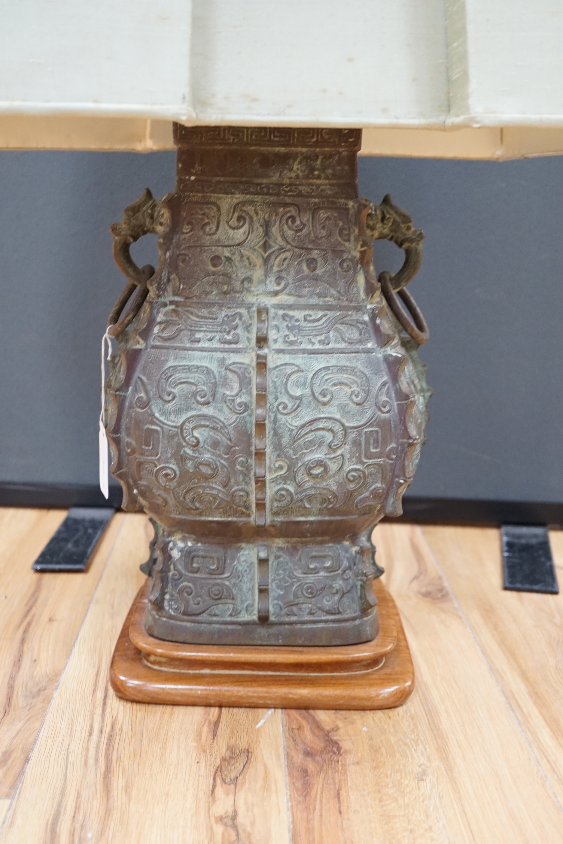 A Chinese archaistic bronze ‘zun’ lamp base, 84cm high including shade